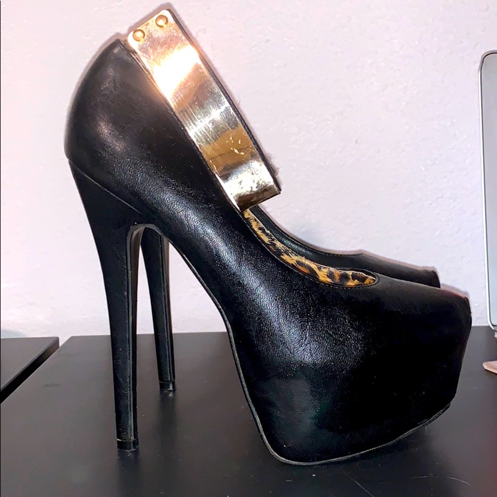 Black heels with gold ankle brace
